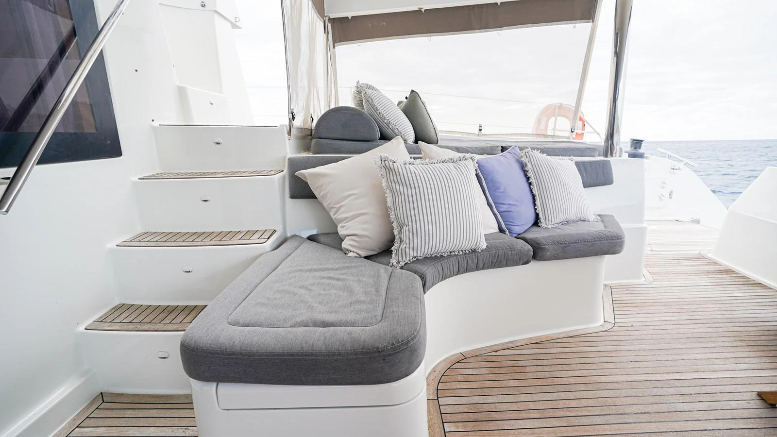 a couch and a table in a room aboard TRUE STORY Yacht for Sale