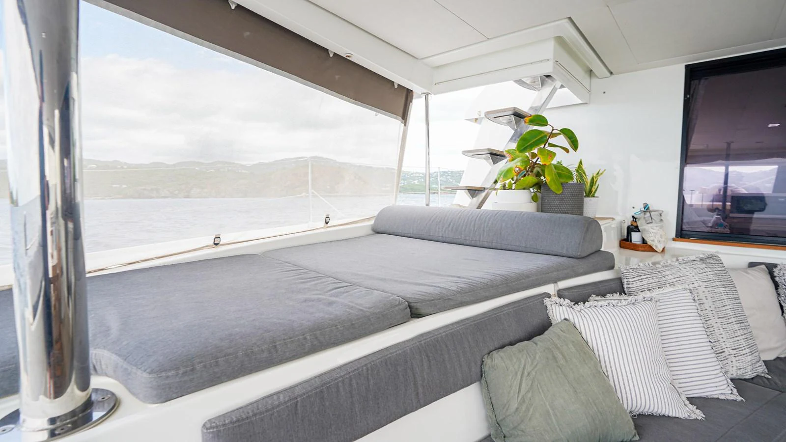 a living room with a large window aboard TRUE STORY Yacht for Sale