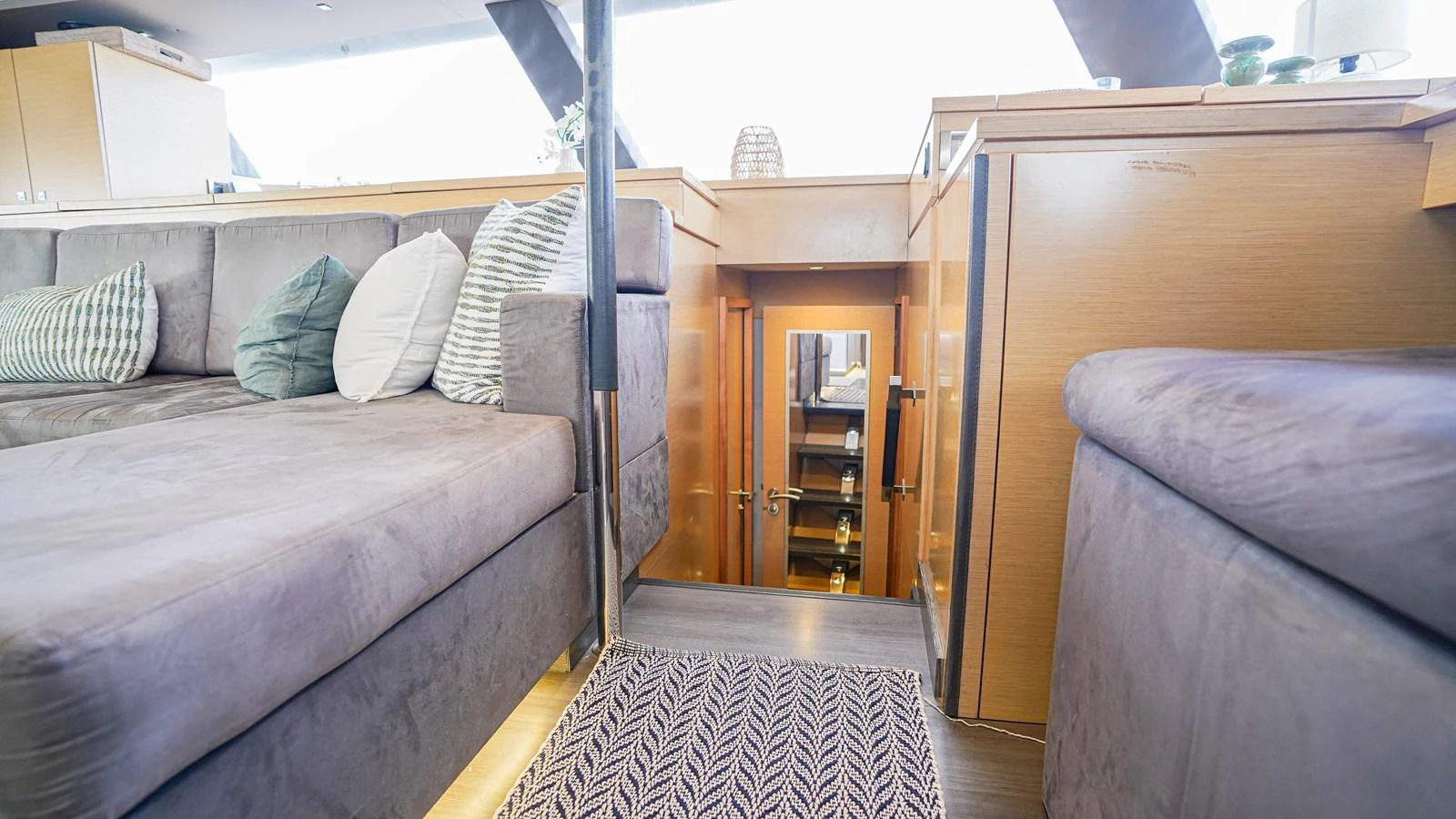 a room with a couch and a bed aboard TRUE STORY Yacht for Sale