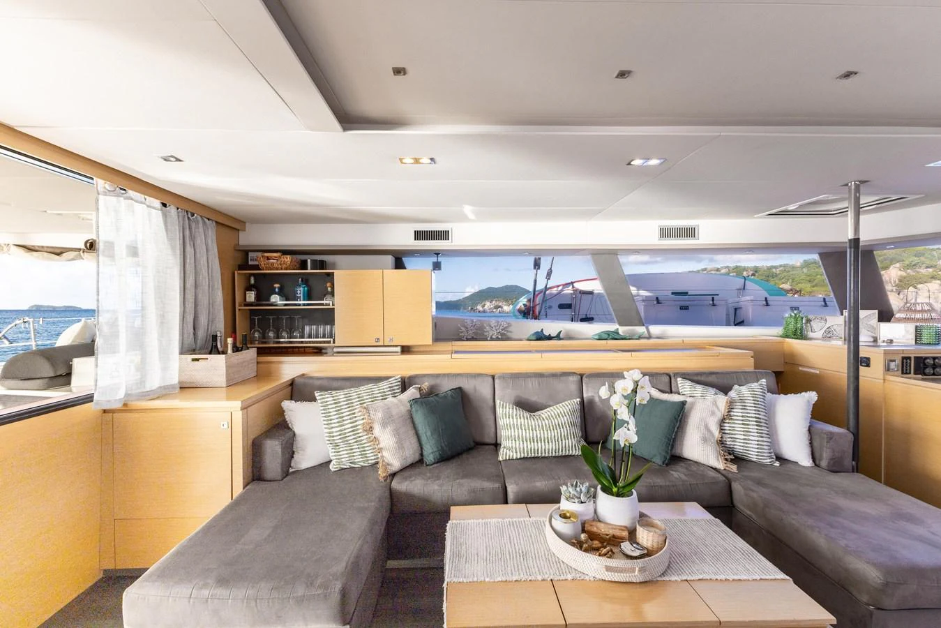 a living room with a large window aboard TRUE STORY Yacht for Sale