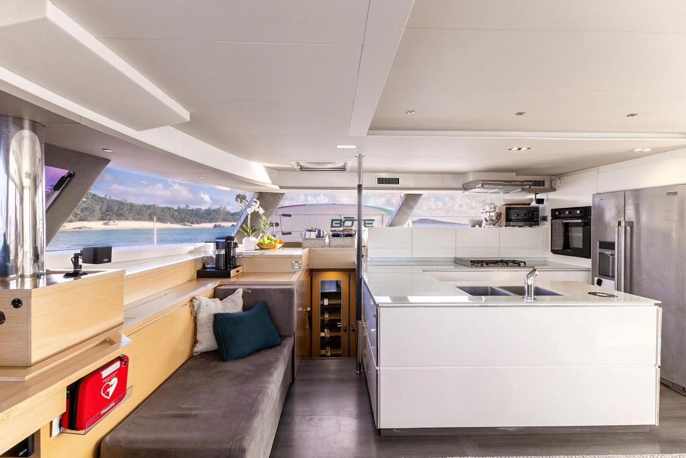a kitchen with a couch and a sink aboard TRUE STORY Yacht for Sale