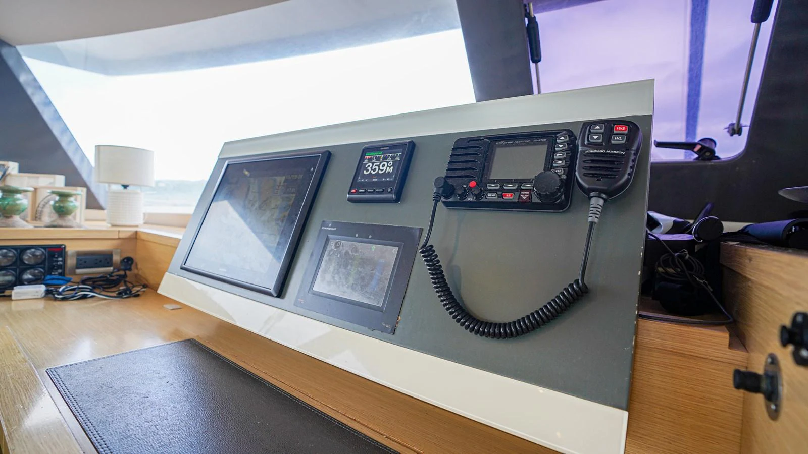 a black electronic device on a desk aboard TRUE STORY Yacht for Sale