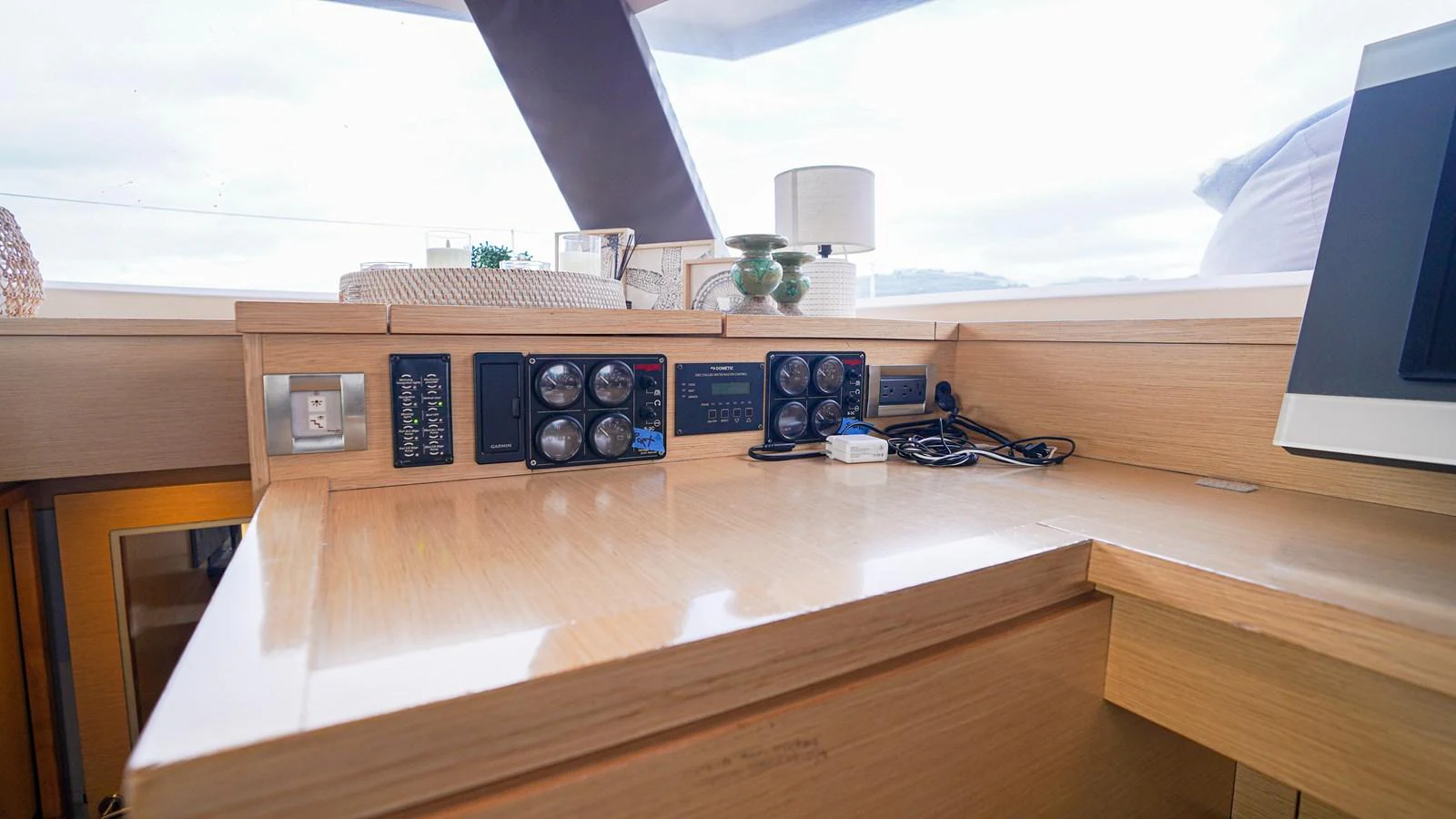 a desk with a computer and speakers aboard TRUE STORY Yacht for Sale
