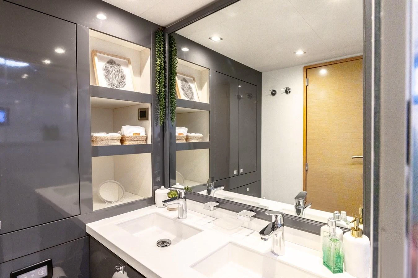 a bathroom with a large mirror aboard TRUE STORY Yacht for Sale