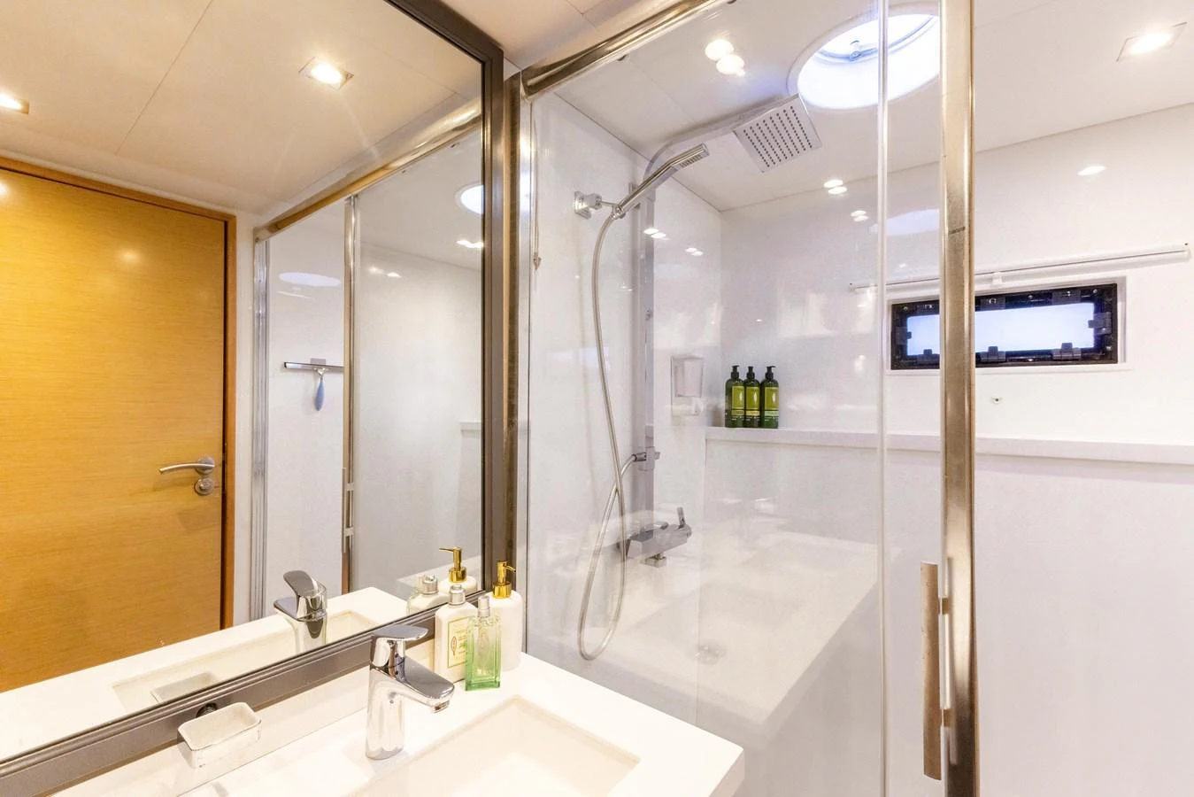 a bathroom with a large mirror aboard TRUE STORY Yacht for Sale