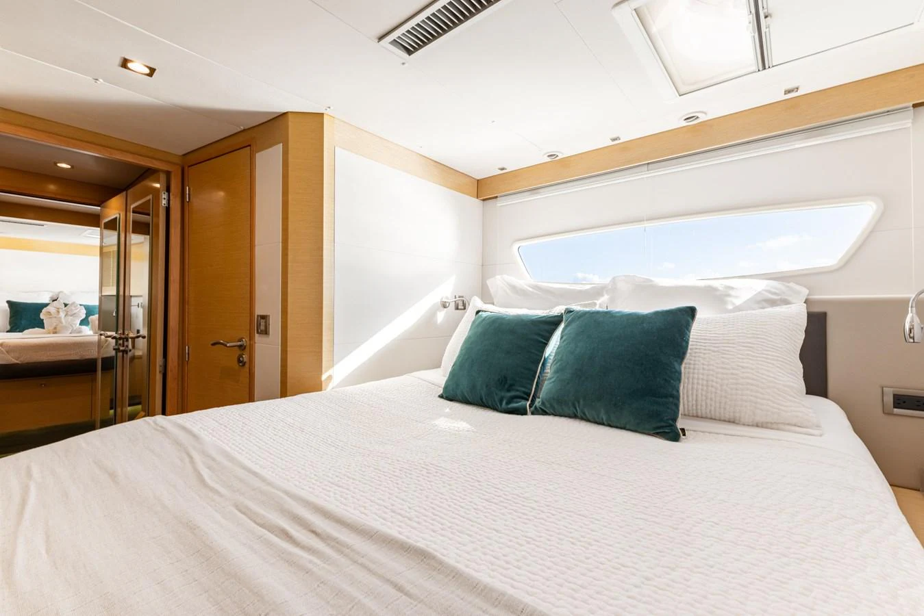 a bed with pillows aboard TRUE STORY Yacht for Sale