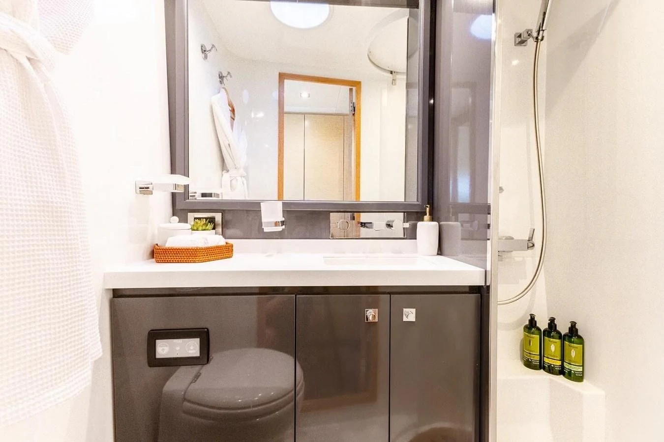 a bathroom with a mirror and a sink aboard TRUE STORY Yacht for Sale
