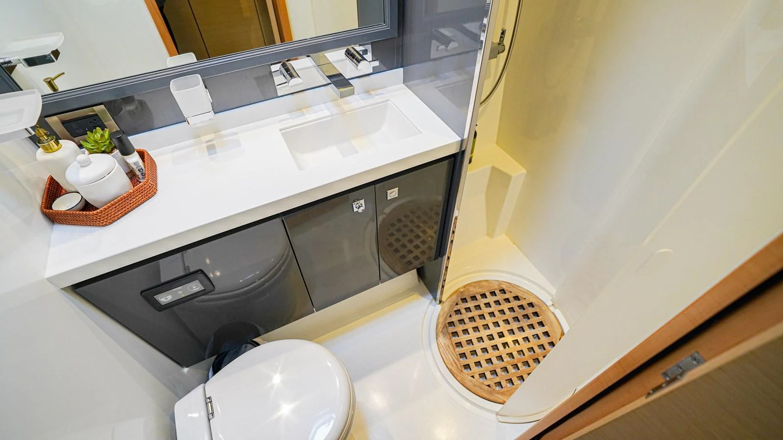 a bathroom with a sink and a basket aboard TRUE STORY Yacht for Sale