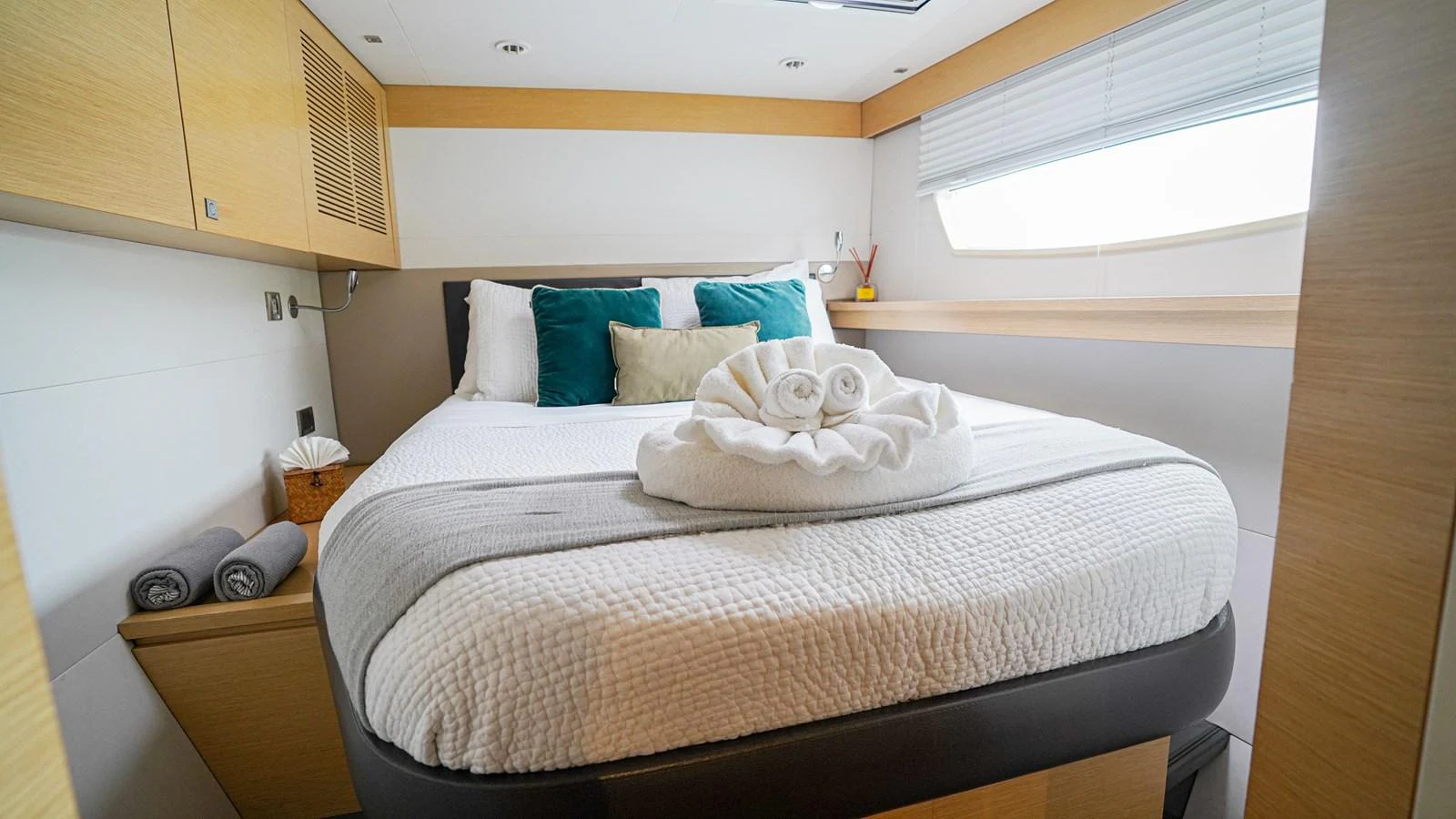 a bed with pillows aboard TRUE STORY Yacht for Sale