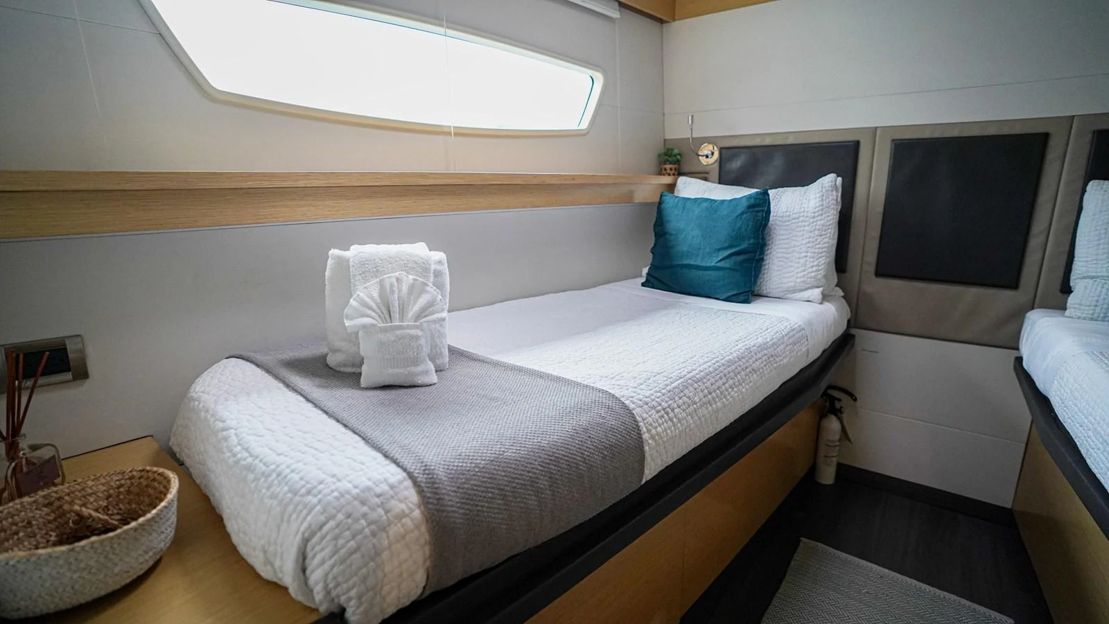 a bed with a white pillow aboard TRUE STORY Yacht for Sale