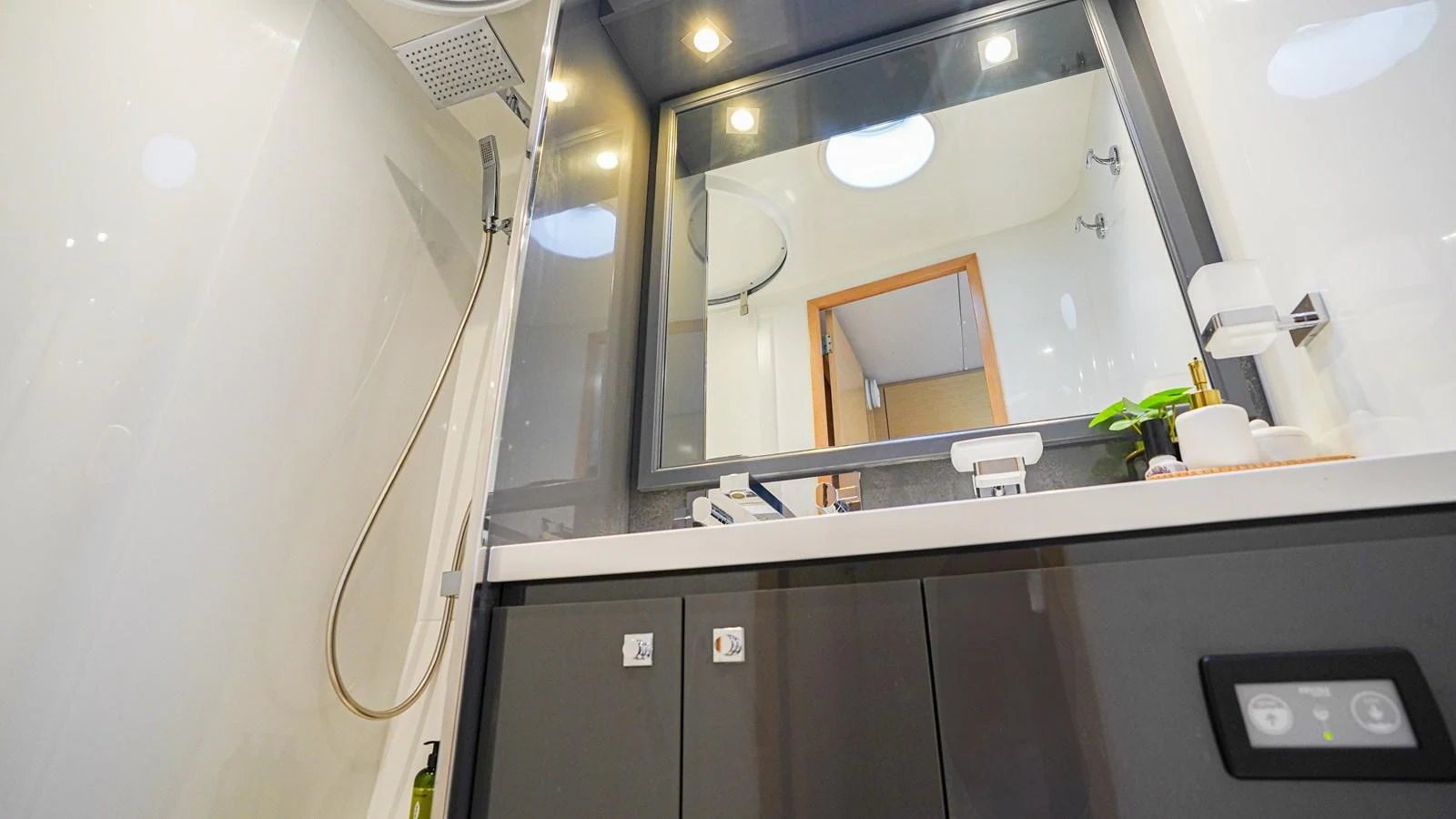 a bathroom with a sink and cabinets aboard TRUE STORY Yacht for Sale