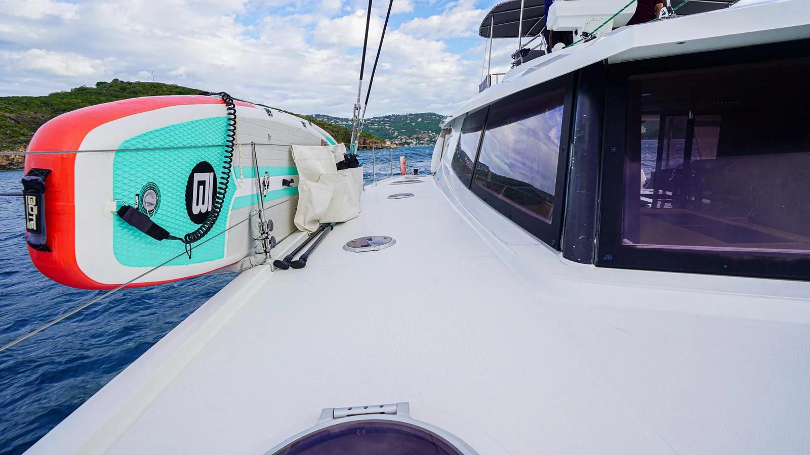 a boat with a flag on the front aboard TRUE STORY Yacht for Sale