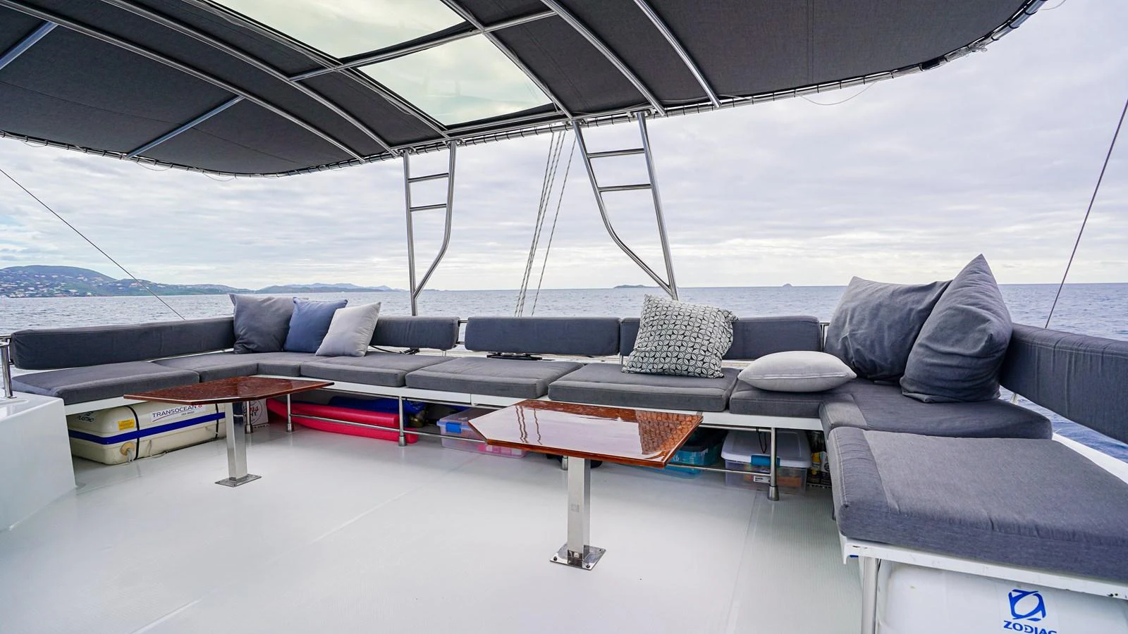 a large lounge area with a table and chairs aboard TRUE STORY Yacht for Sale