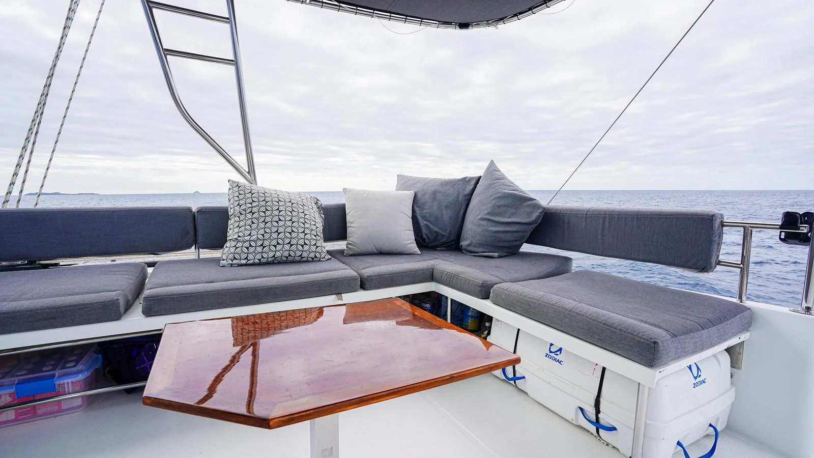 a couch with pillows on it aboard TRUE STORY Yacht for Sale