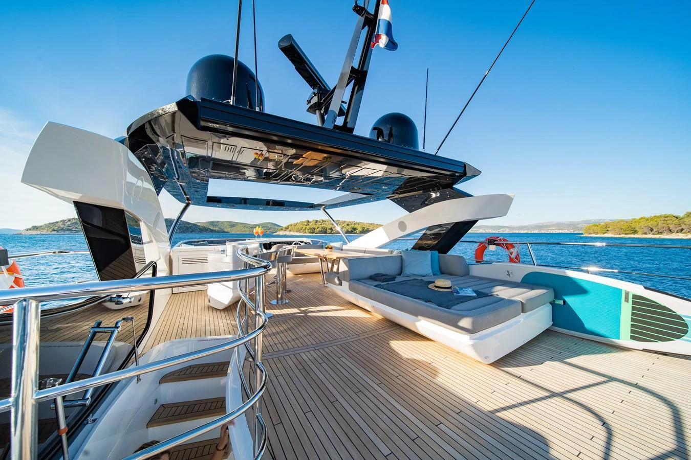 The aft deck offers a spacious lounging area with comfortable seating and stunning views of the surrounding waters. aboard BLACK MAMBA Yacht for Sale