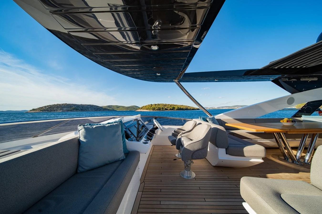 The flybridge offers a luxurious outdoor seating area with stunning views of the surrounding waters. aboard BLACK MAMBA Yacht for Sale