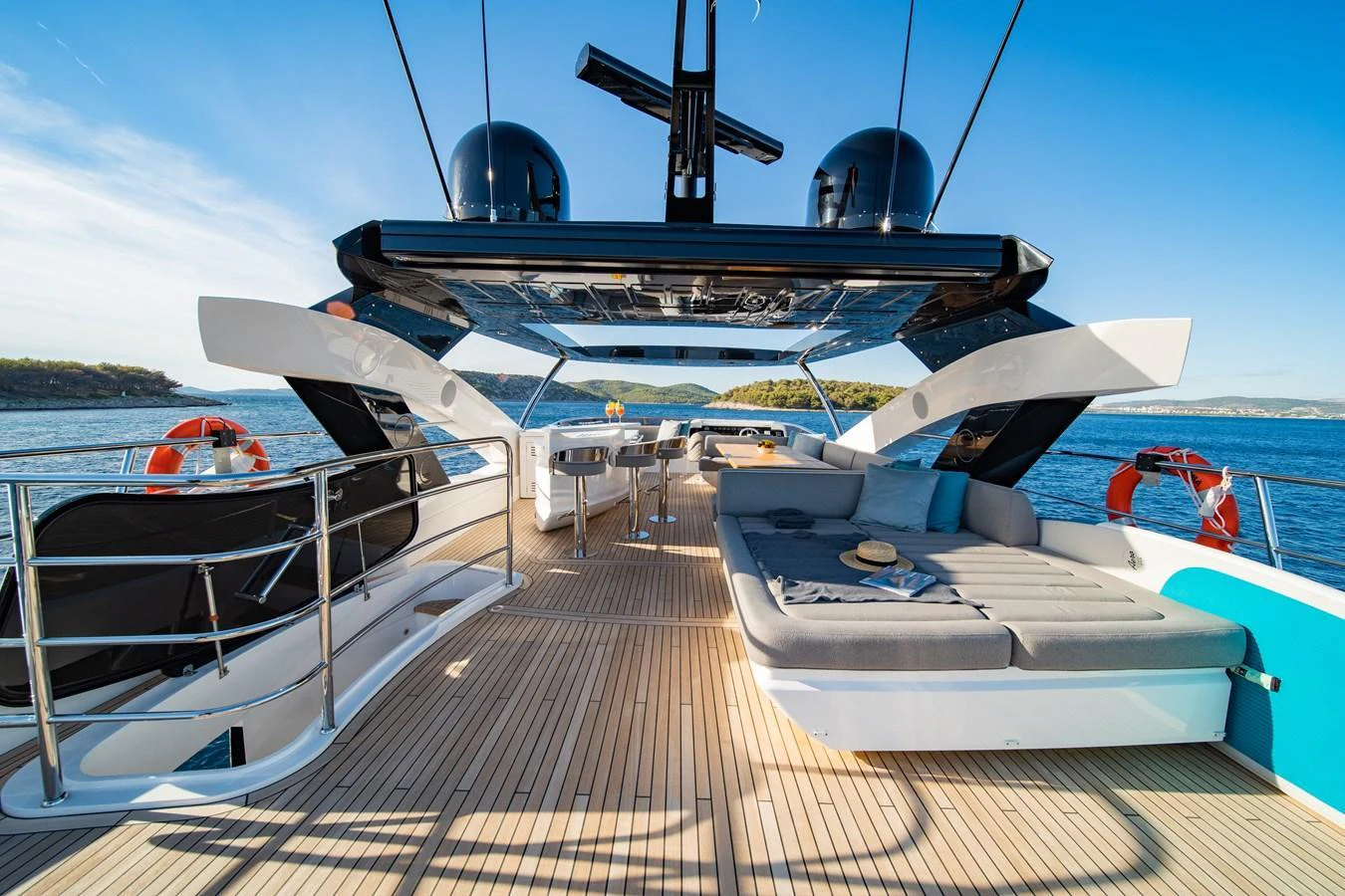The flybridge offers a spacious and luxurious area for relaxation and entertainment with stunning ocean views. aboard BLACK MAMBA Yacht for Sale