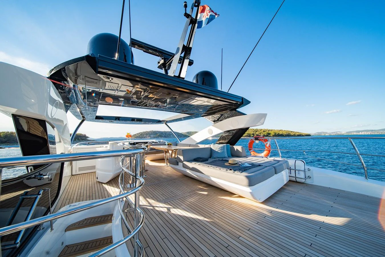 The spacious aft deck features luxurious lounging areas with stunning views of the water. aboard BLACK MAMBA Yacht for Sale
