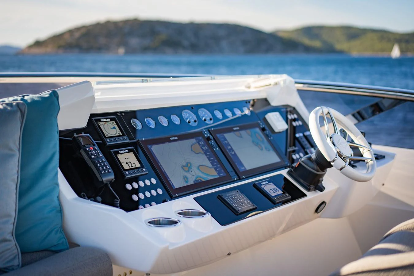 The helm station features advanced navigation equipment and a sleek steering wheel, offering a commanding view of the surroundings. aboard BLACK MAMBA Yacht for Sale