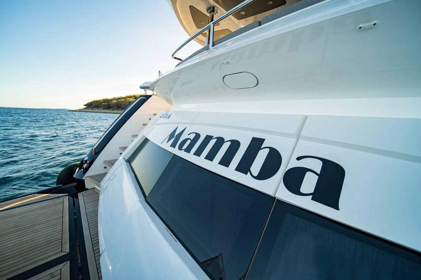 The sleek exterior of the yacht features a modern design with elegant lines and a spacious deck area. aboard BLACK MAMBA Yacht for Sale