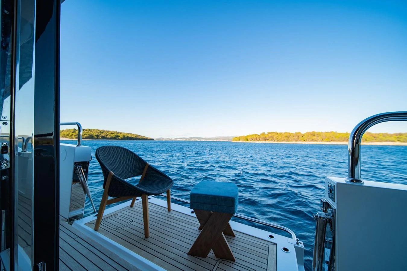 The aft deck offers a serene view of the water, complemented by stylish seating. aboard BLACK MAMBA Yacht for Sale