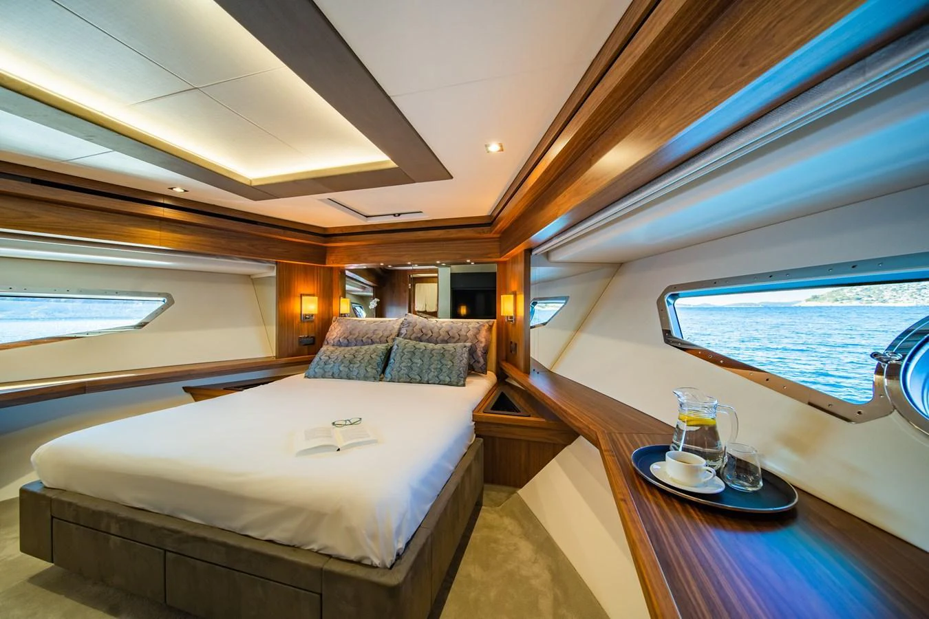 A luxurious stateroom with large windows offering stunning sea views. aboard BLACK MAMBA Yacht for Sale