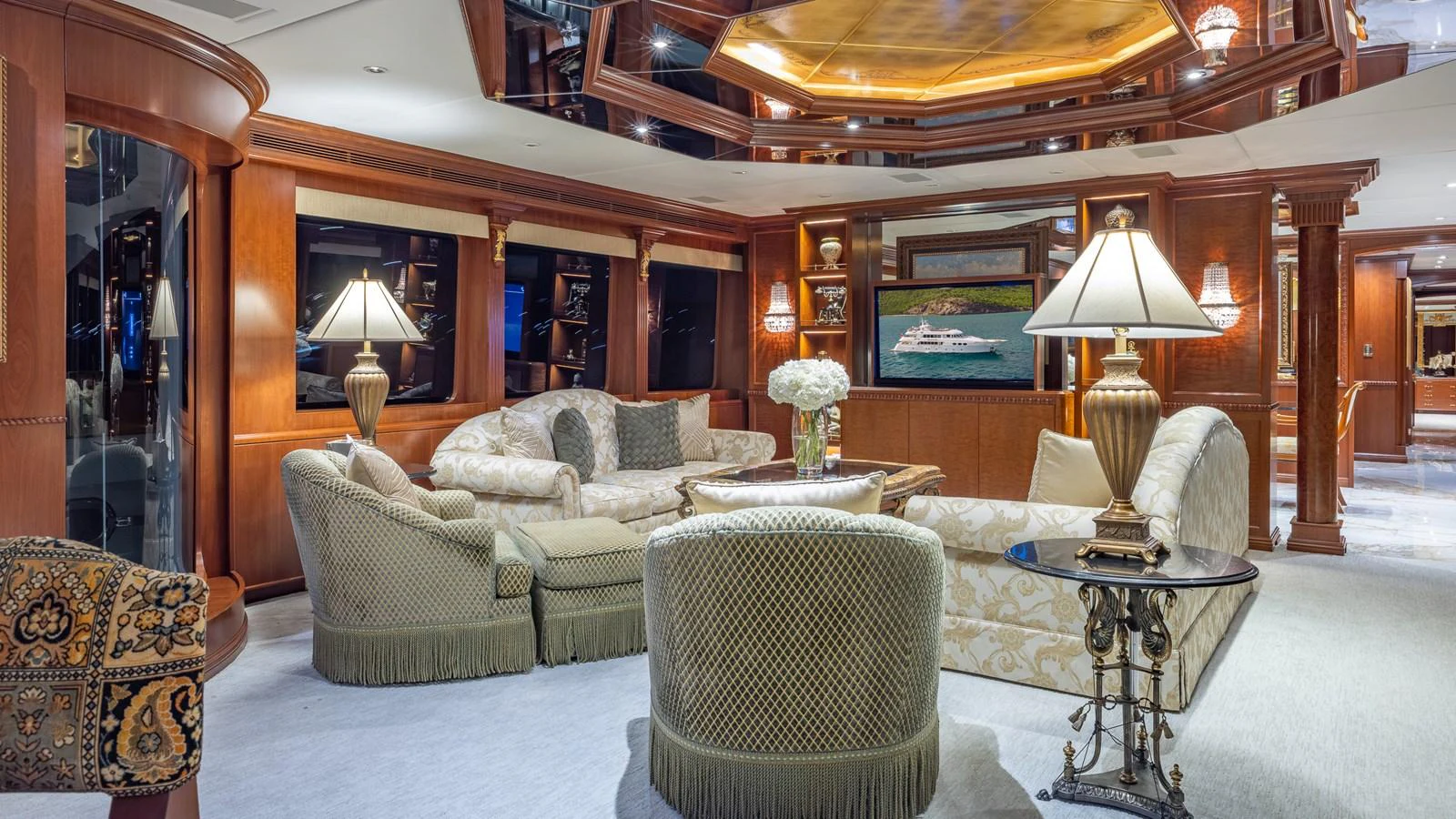The yacht's salon exudes elegance with plush seating and warm wooden accents. aboard RELENTLESS Yacht for Sale