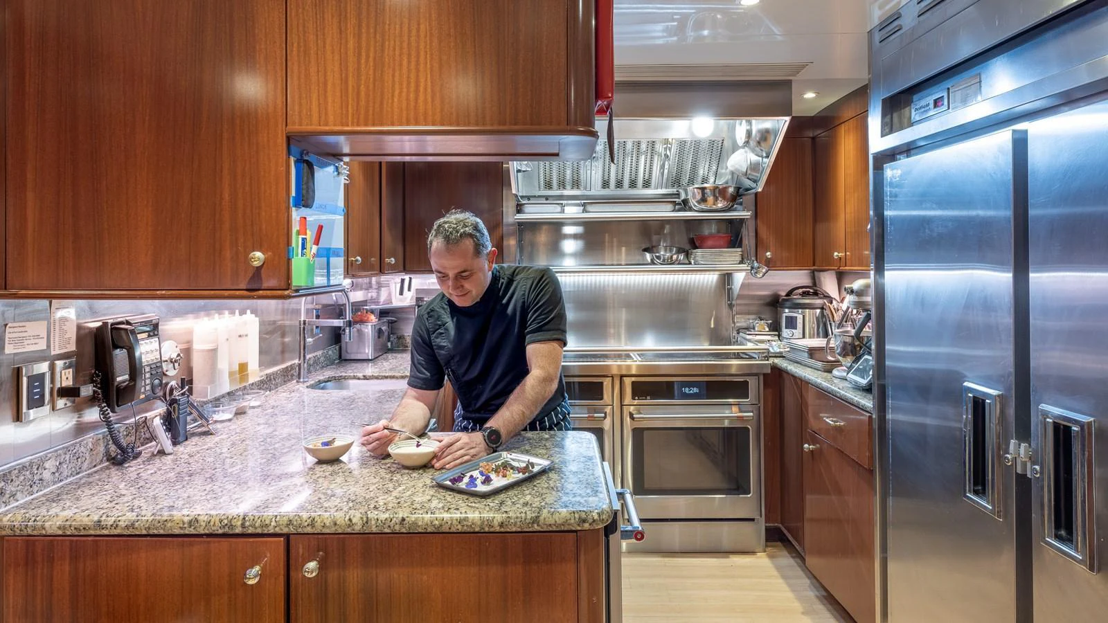 The galley features modern appliances and ample counter space, creating a functional and stylish cooking area. aboard RELENTLESS Yacht for Sale