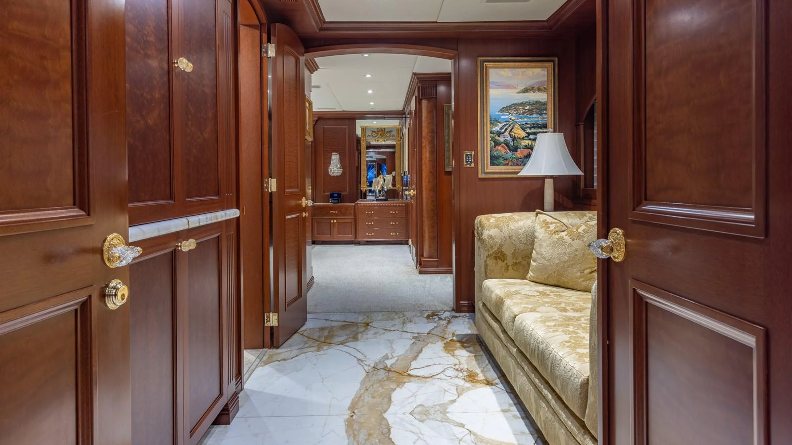 The yacht's interior features luxurious wood paneling, marble flooring, and elegant furnishings. aboard RELENTLESS Yacht for Sale