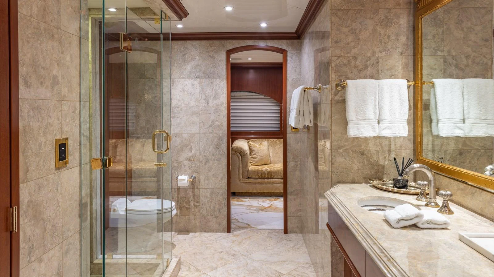 A luxurious bathroom featuring marble surfaces and elegant fixtures. aboard RELENTLESS Yacht for Sale