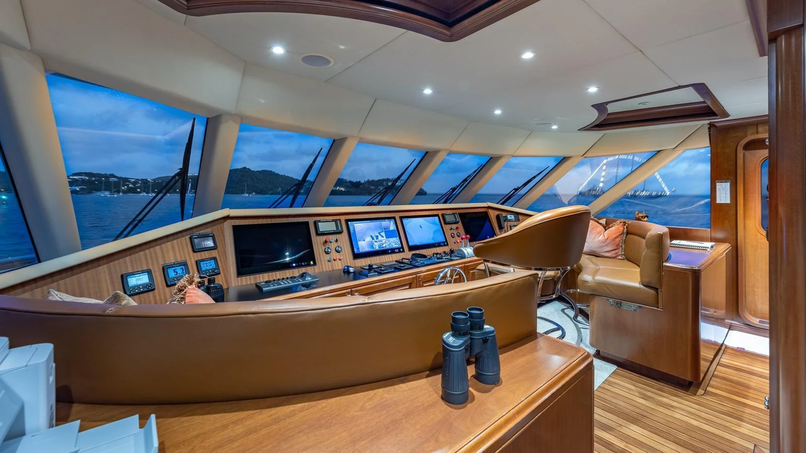 The helm station offers a panoramic view with state-of-the-art navigation equipment and luxurious seating. aboard RELENTLESS Yacht for Sale