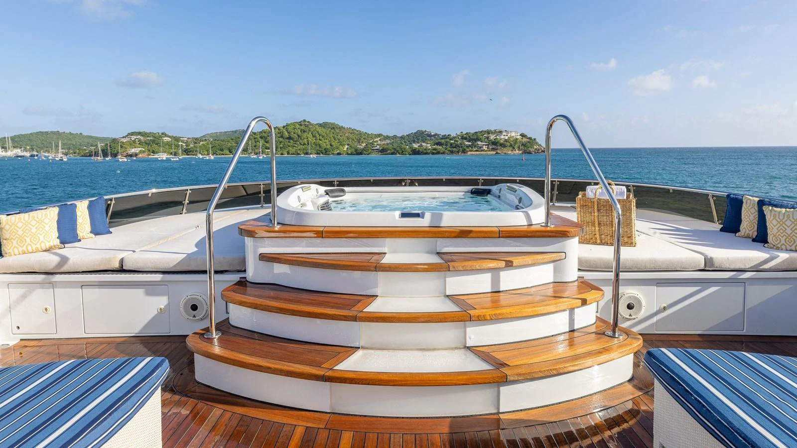 The sundeck features a luxurious jacuzzi with surrounding sun pads and scenic views. aboard RELENTLESS Yacht for Sale