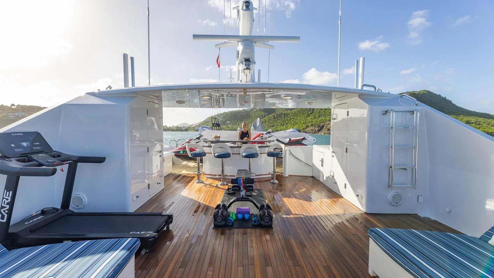 The sundeck features a well-equipped gym area with stunning views. aboard RELENTLESS Yacht for Sale