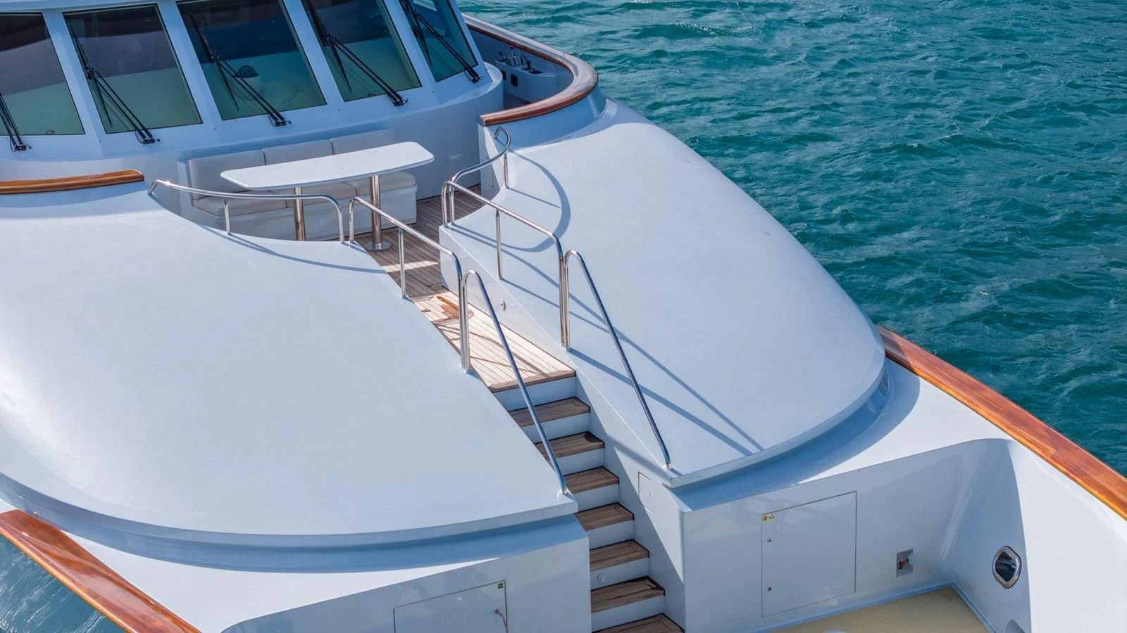 The yacht's bow features a sleek design with a spacious deck area and elegant railings. aboard RELENTLESS Yacht for Sale