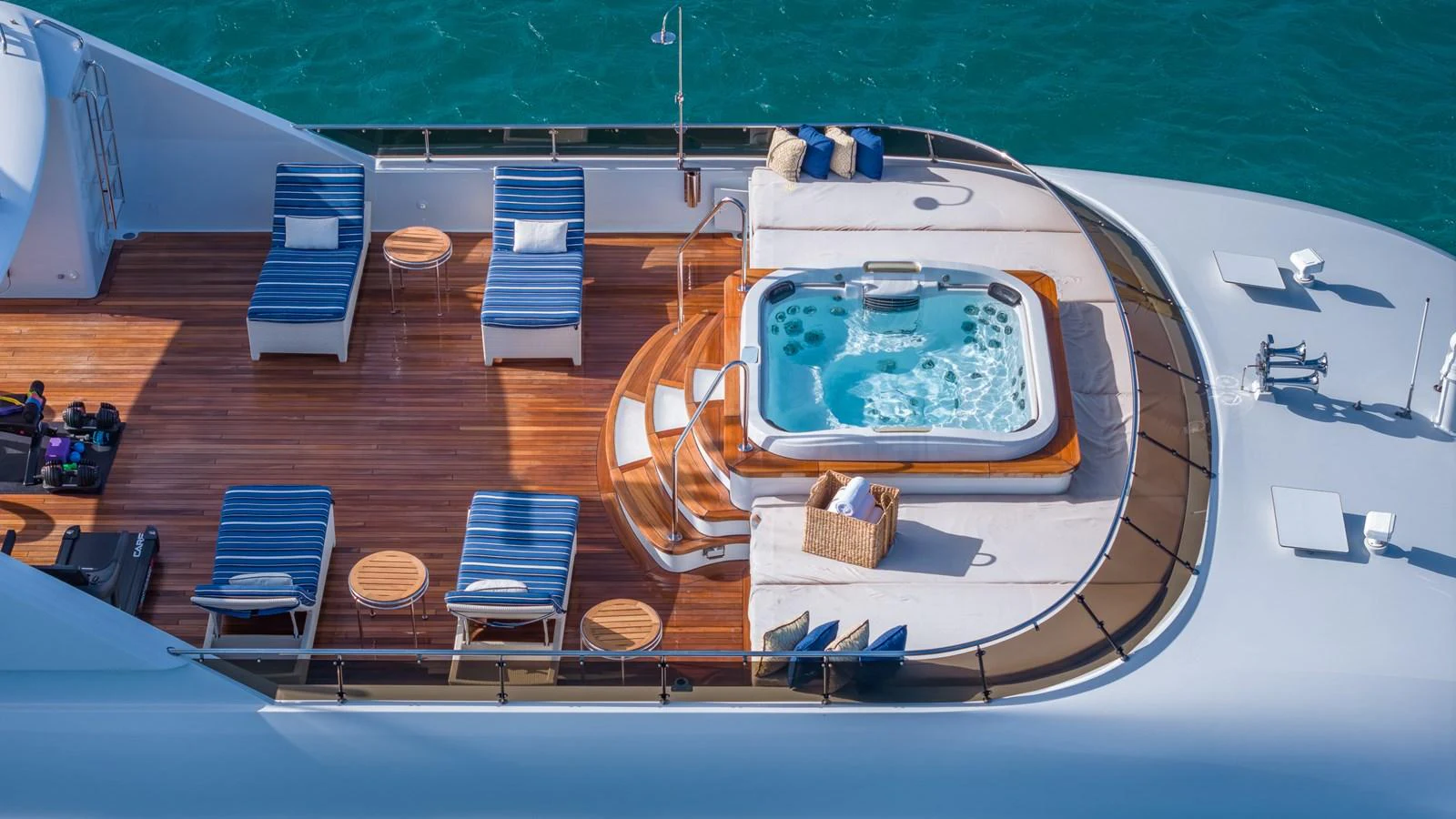 The sundeck features a luxurious jacuzzi surrounded by comfortable lounge chairs and teak decking. aboard RELENTLESS Yacht for Sale