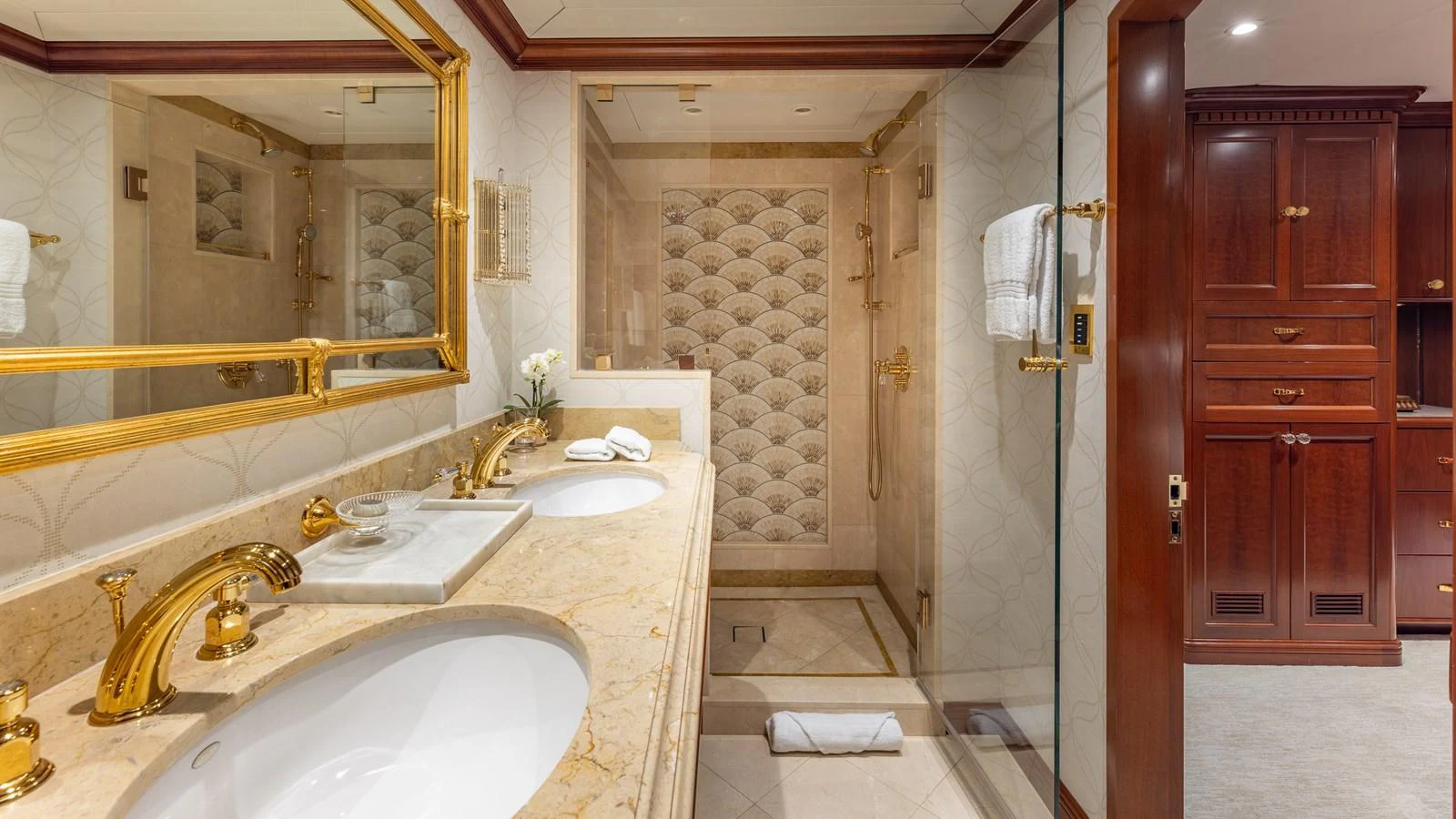 The luxurious bathroom features elegant fixtures and a spacious shower area. aboard RELENTLESS Yacht for Sale