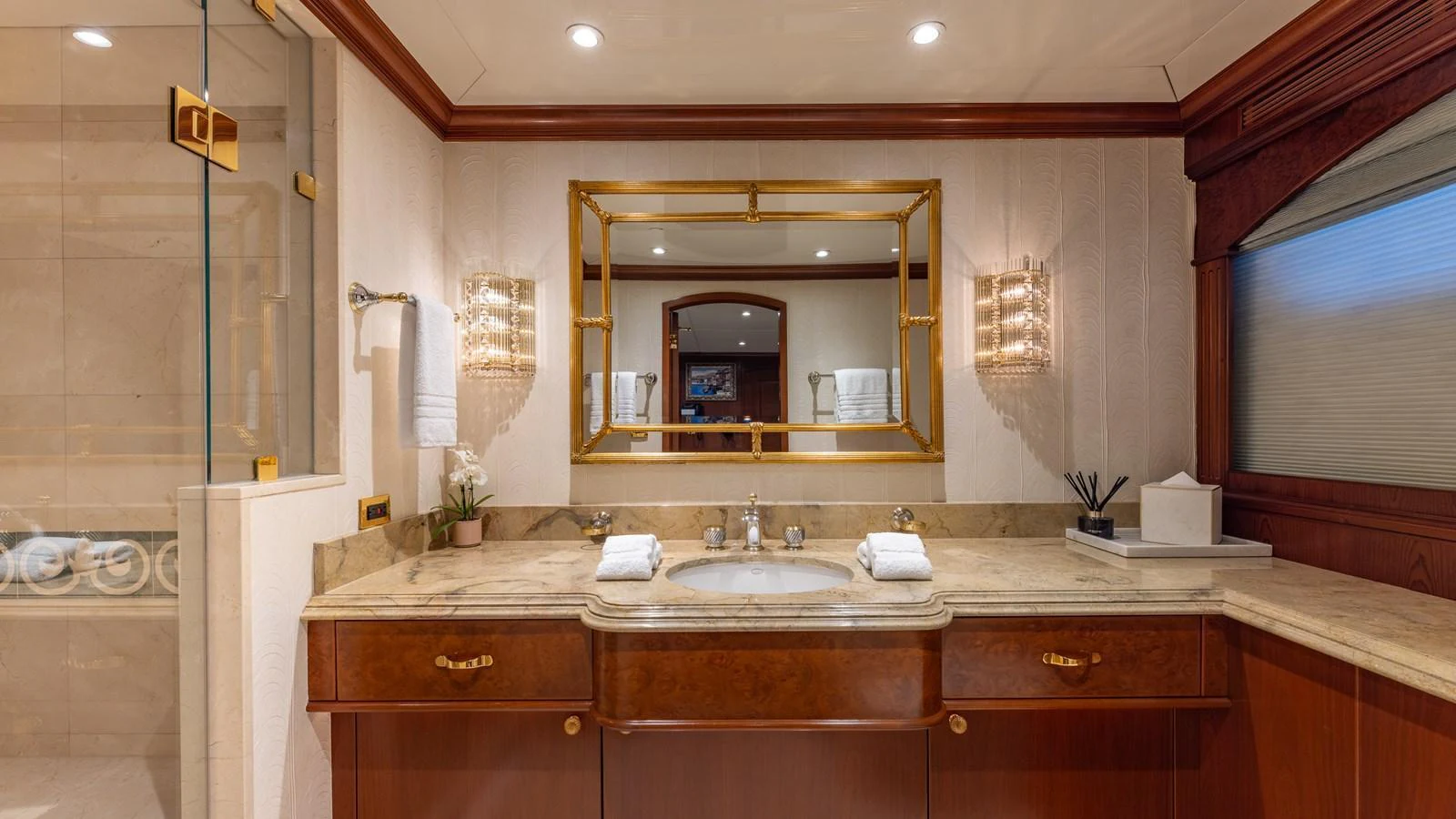 The yacht's bathroom features elegant fixtures and a luxurious design. aboard RELENTLESS Yacht for Sale