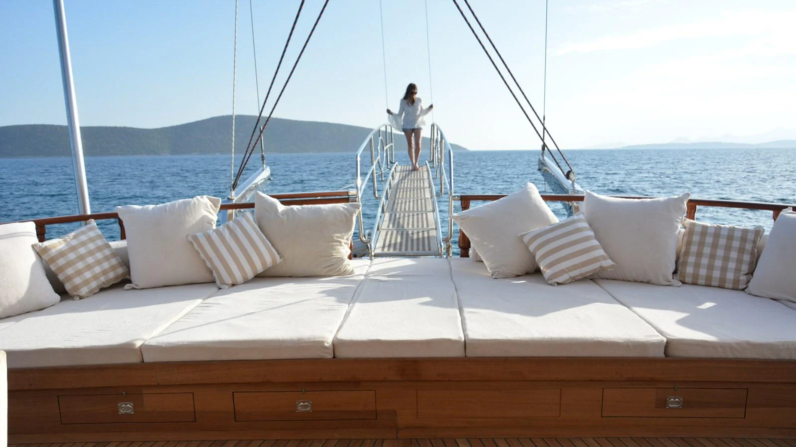 The aft deck features a spacious lounging area with plush cushions, perfect for relaxation while enjoying the sea view. aboard PAPA JOE Yacht for Sale