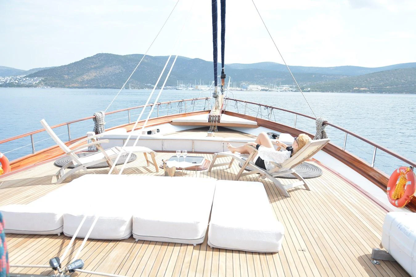 The foredeck features luxurious sun loungers and a spacious seating area, perfect for relaxation. aboard PAPA JOE Yacht for Sale