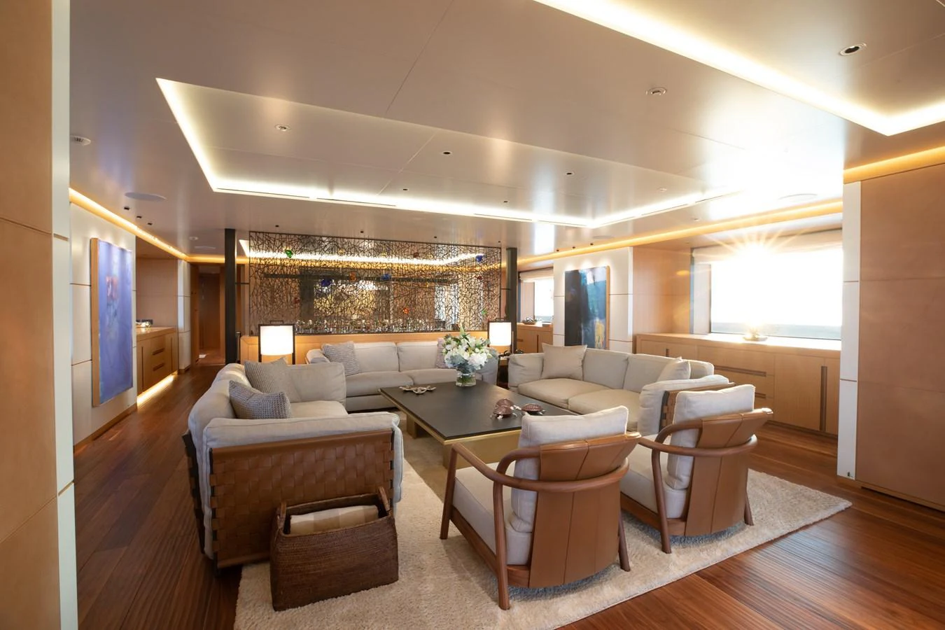 The salon features a spacious and elegant seating area with modern furnishings and ample natural light. aboard ALCHEMIST Yacht for Sale