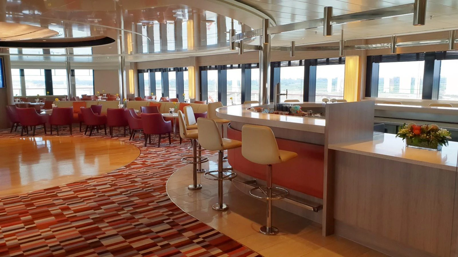 The yacht's interior lounge features a stylish bar area with comfortable seating and panoramic windows. aboard MINERVA Yacht for Sale