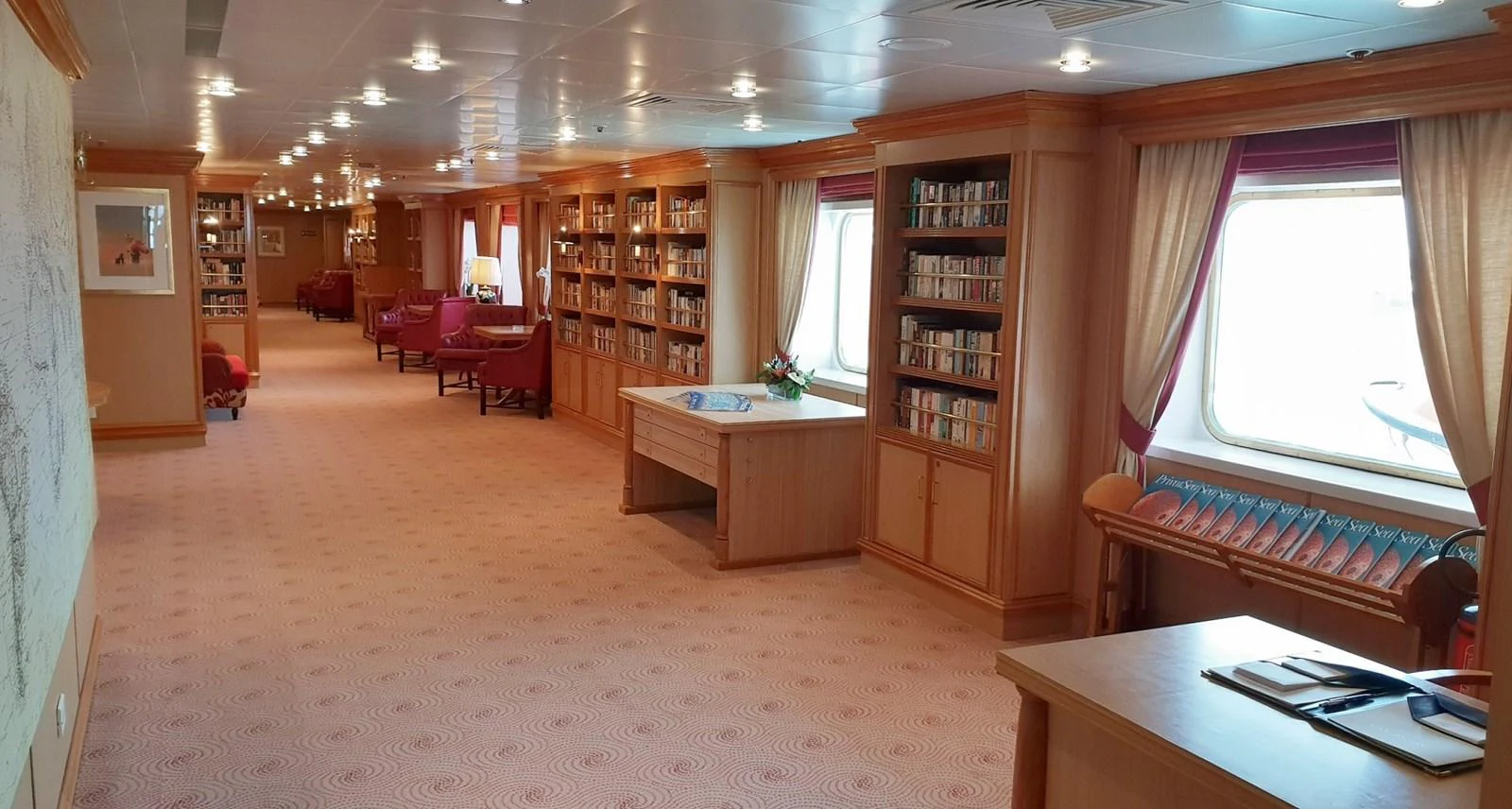 The yacht's library offers a serene and elegant space for reading and relaxation. aboard MINERVA Yacht for Sale