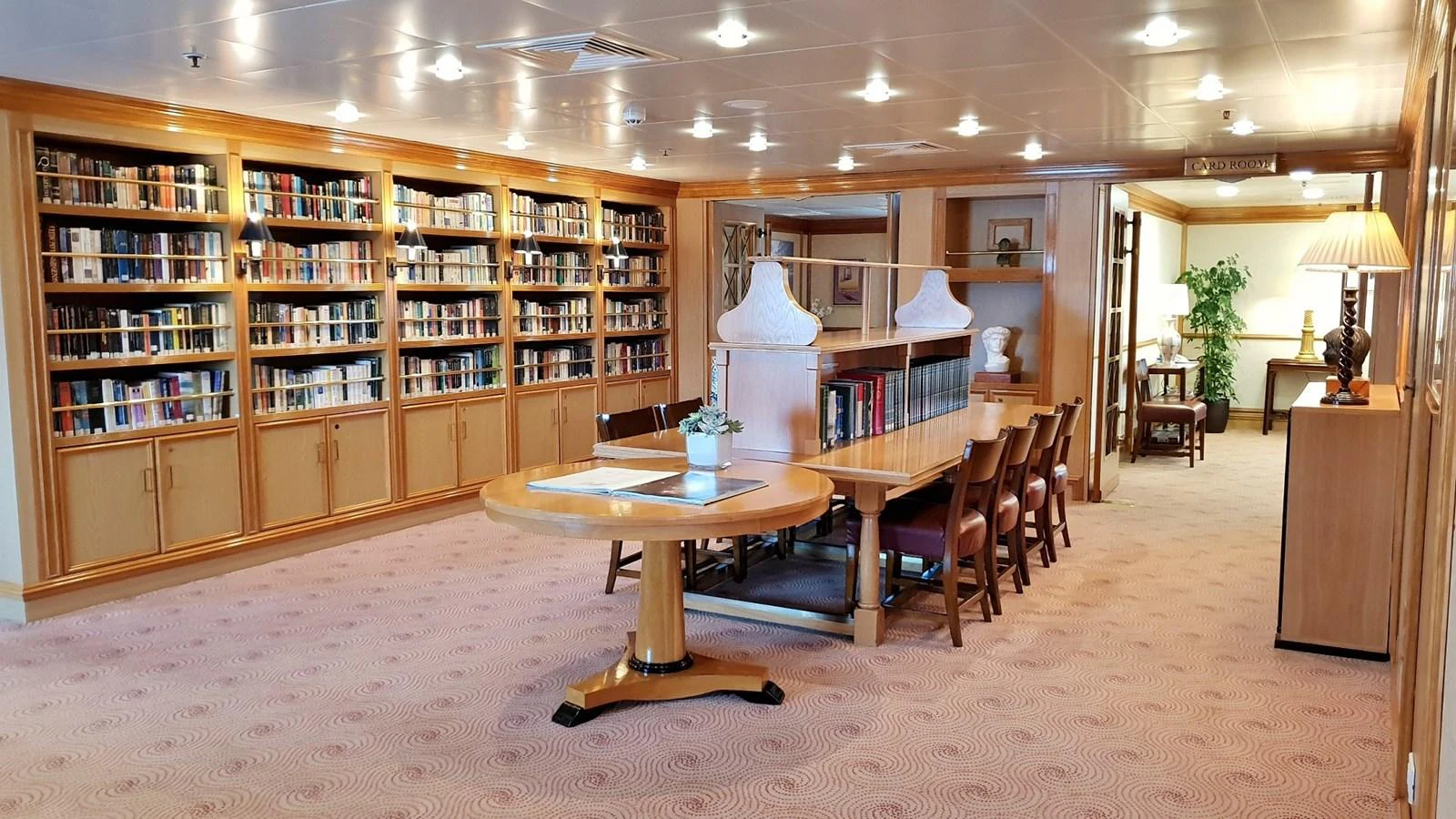 The yacht's library offers a serene and elegant space for reading and relaxation. aboard MINERVA Yacht for Sale