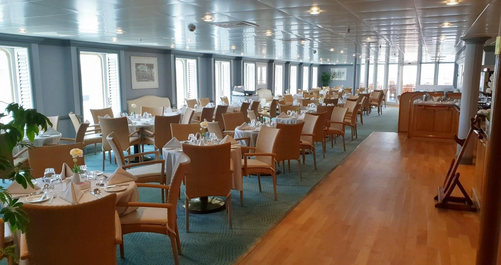 The spacious dining area features elegant table settings and ample seating for guests. aboard MINERVA Yacht for Sale