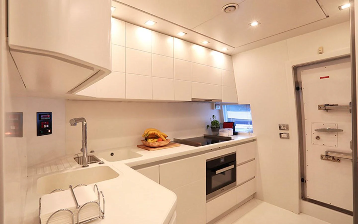 The yacht's galley is sleek and modern, featuring high-end appliances and ample counter space. aboard NIKCA Yacht for Sale