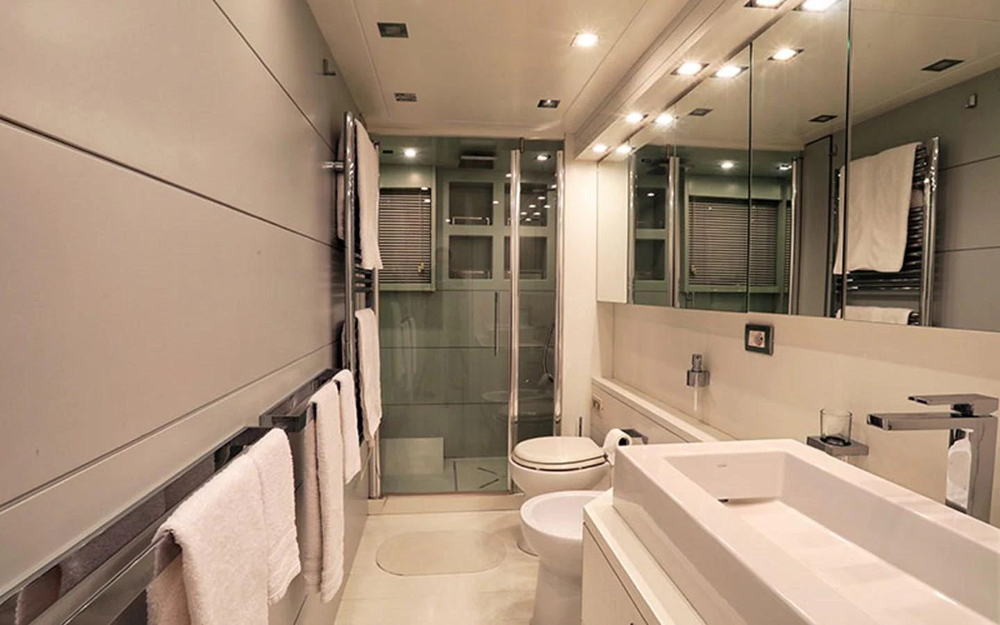 The yacht's bathroom features modern fixtures and a sleek design, providing a luxurious and comfortable space. aboard NIKCA Yacht for Sale