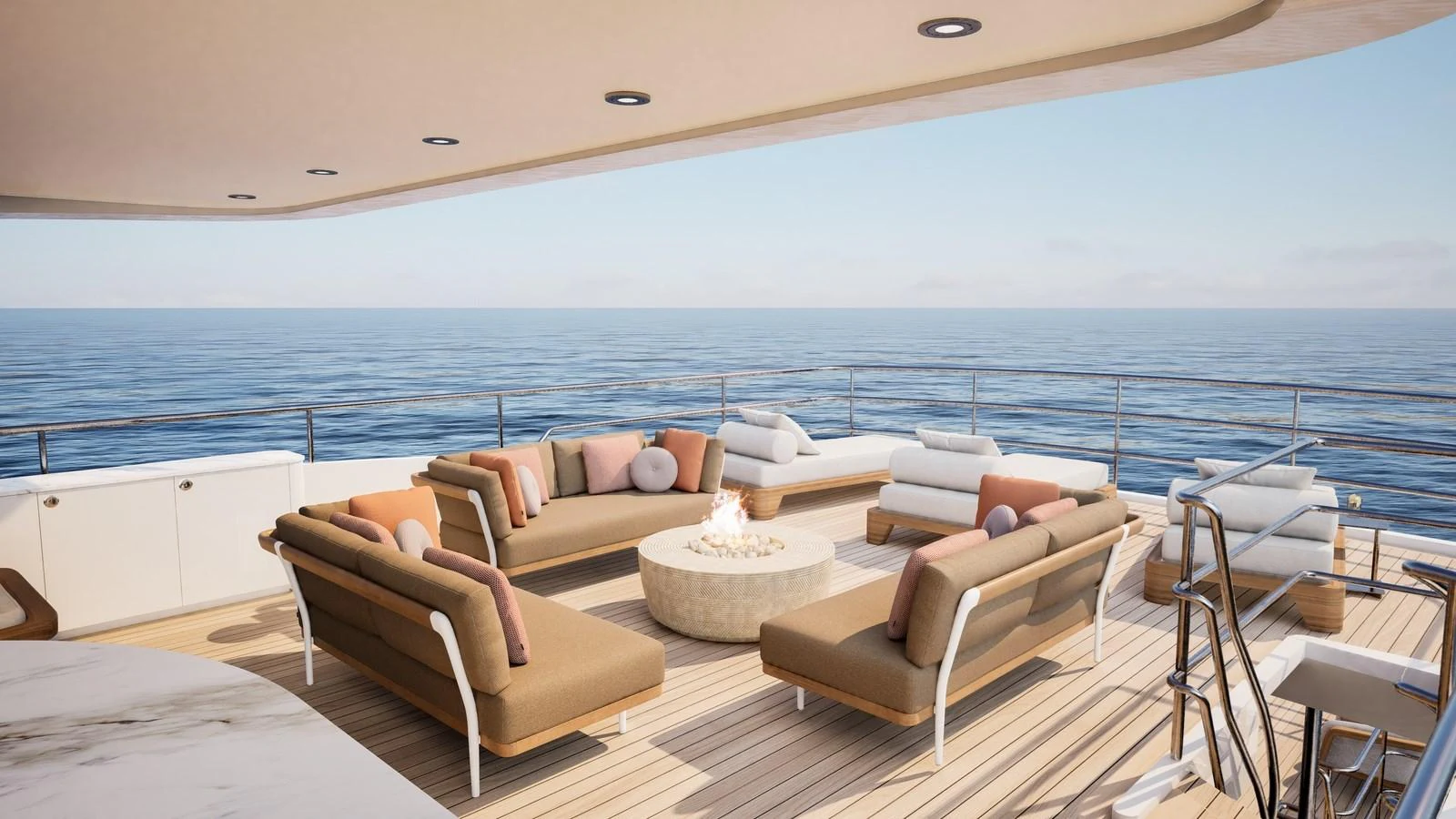 The aft deck features a luxurious seating area with a central fire pit, offering stunning ocean views. aboard YN208 Yacht for Sale