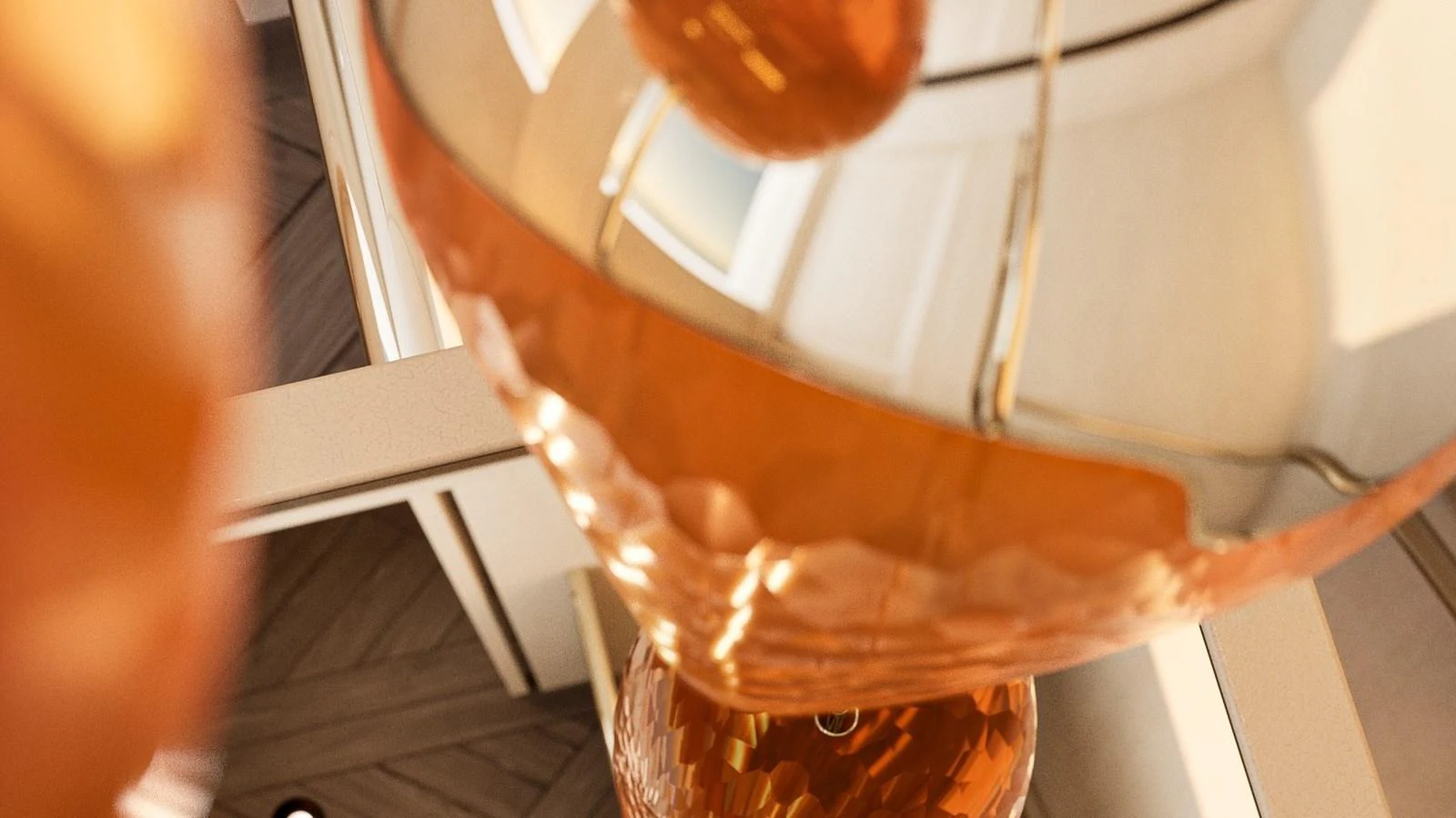 A close-up view of a stylish, reflective light fixture with warm tones. aboard YN208 Yacht for Sale