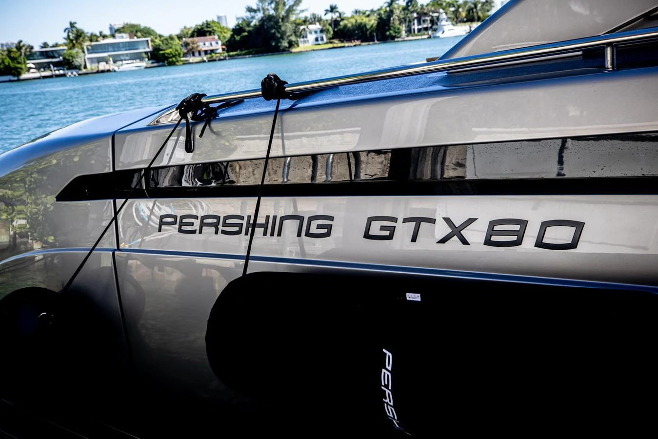 A close-up view of the yacht's branding, showcasing the sleek design and name 'Pershing GTX80'. aboard CIAO Yacht for Sale