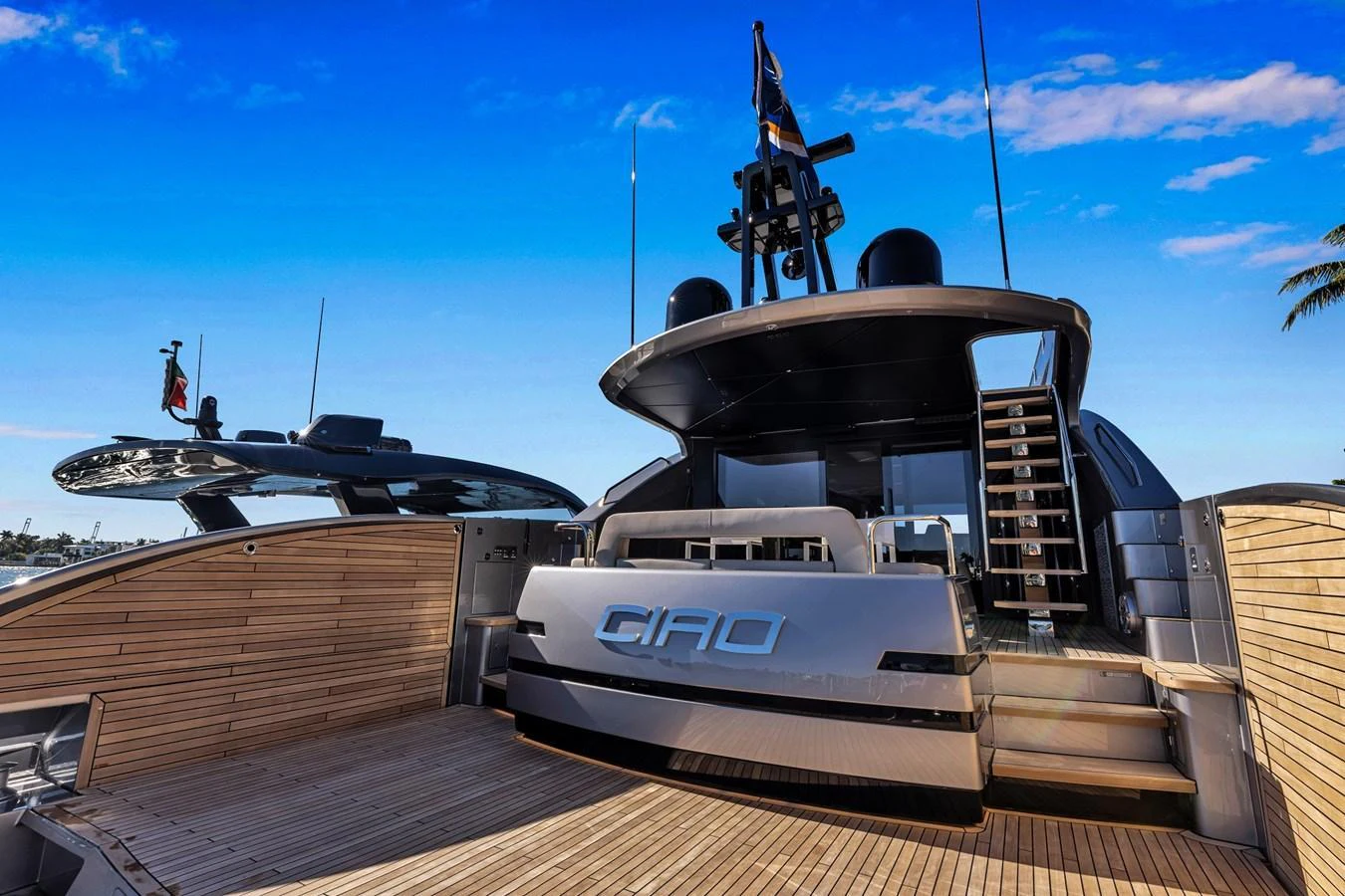 The yacht's aft deck showcases a sleek and modern design with ample space for relaxation. aboard CIAO Yacht for Sale